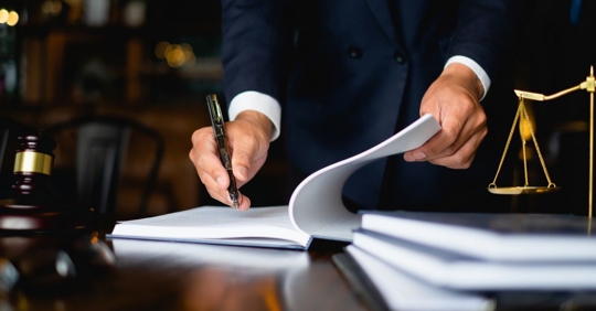 Lawyer writing on paper