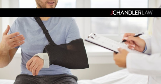 man with injured arm